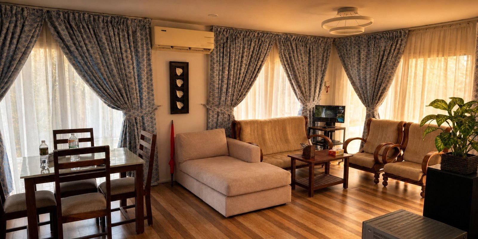 Mayooram living area with comfortable seating and dining space