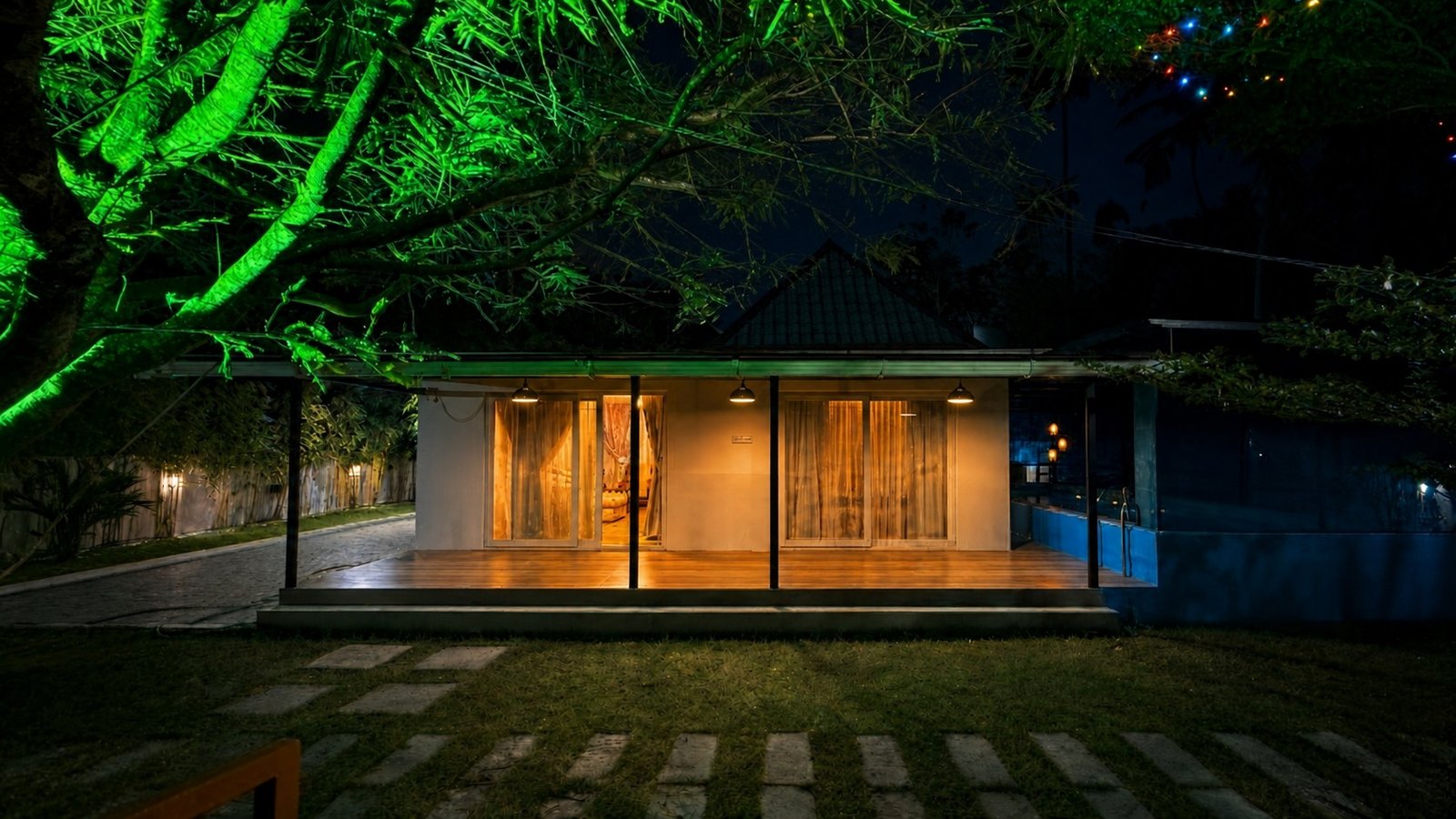 Mayooram villa illuminated at night